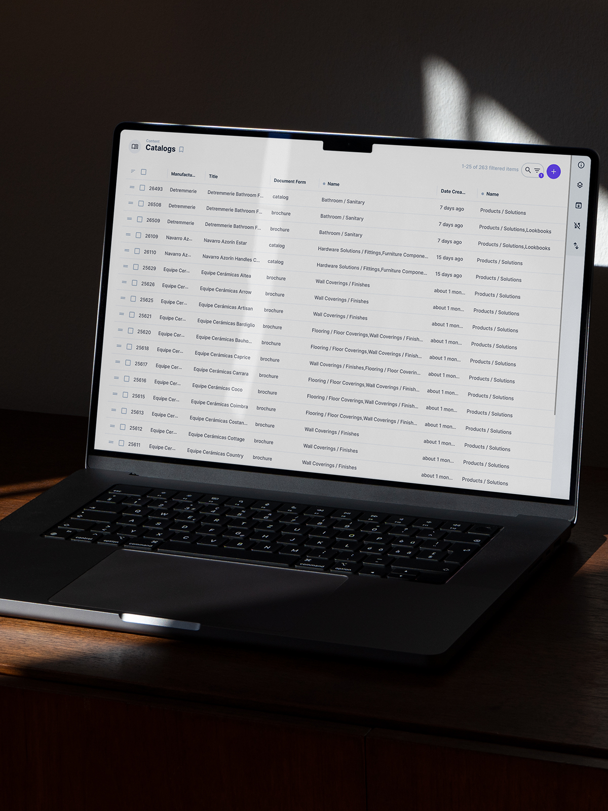 A product catalog spreadsheet open beside its source PDF, showing rows classified by category.