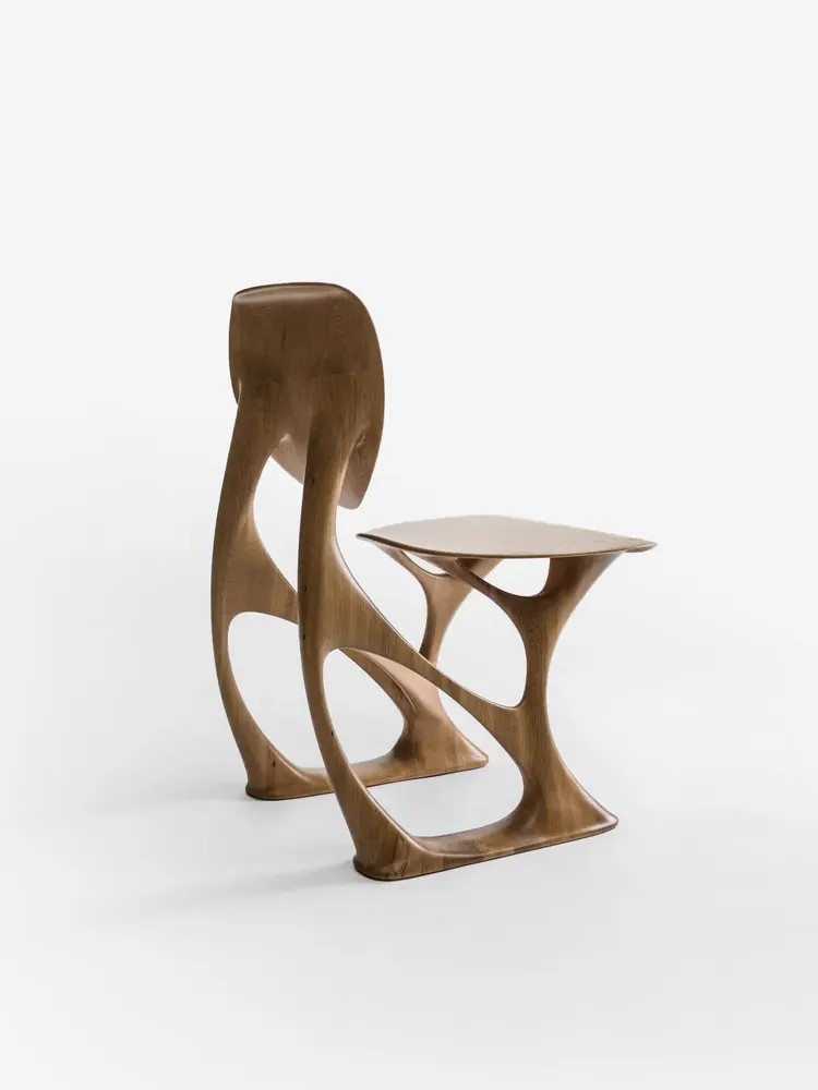 A sculptural wooden side table from the archive.